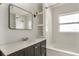 Modern bathroom featuring a sleek vanity, marble countertop, and subway tile shower at 3307 W Ballast Point Blvd, Tampa, FL 33611