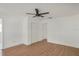 Inviting bedroom with wood-look flooring and a ceiling fan for added comfort at 3307 W Ballast Point Blvd, Tampa, FL 33611