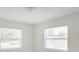 Bright bedroom with two windows offering natural light, creating a comfortable and inviting space at 3307 W Ballast Point Blvd, Tampa, FL 33611