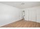 Spacious bedroom with wood-look flooring and a double-door closet, perfect for storage at 3307 W Ballast Point Blvd, Tampa, FL 33611
