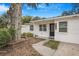 Close-up of the front of a single-story home with a black front door and clear address numbers at 3307 W Ballast Point Blvd, Tampa, FL 33611