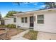 Close-up of the front of a single-story home with a black front door and clear address numbers at 3307 W Ballast Point Blvd, Tampa, FL 33611