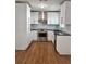 Modern kitchen features white cabinetry, stainless steel appliances, and granite countertops, providing a stylish space at 3307 W Ballast Point Blvd, Tampa, FL 33611