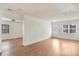 Spacious living room with white walls, hardwood floors, and a large front door at 3307 W Ballast Point Blvd, Tampa, FL 33611
