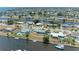 Aerial view of a waterfront home with a canal and well-maintained landscaping at 149 Roselle Ct, Port Charlotte, FL 33952