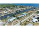 Aerial view of a coastal neighborhood with waterfront homes and canals at 149 Roselle Ct, Port Charlotte, FL 33952