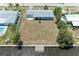 Aerial view of home featuring a waterfront backyard and private dock at 149 Roselle Ct, Port Charlotte, FL 33952