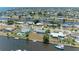 Aerial view of the home in a canal community with waterfront access at 149 Roselle Ct, Port Charlotte, FL 33952