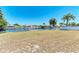 Waterfront property with private dock, seawall, and lush landscaping provides an ideal setting for relaxation and entertainment at 149 Roselle Ct, Port Charlotte, FL 33952