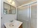 Bathroom featuring a glass enclosed shower and wood cabinet sink at 149 Roselle Ct, Port Charlotte, FL 33952