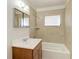 Bright bathroom with shower over tub combo and vanity at 149 Roselle Ct, Port Charlotte, FL 33952