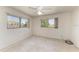 Bedroom features neutral walls, two windows, and a ceiling fan at 149 Roselle Ct, Port Charlotte, FL 33952