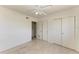 A bright bedroom features a ceiling fan, carpeted floors, and closet for storage at 149 Roselle Ct, Port Charlotte, FL 33952