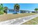 Lovely single story home featuring a well-manicured front yard and inviting entrance at 149 Roselle Ct, Port Charlotte, FL 33952
