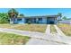 Attractive single-story home featuring a well-manicured front yard and concrete driveway at 149 Roselle Ct, Port Charlotte, FL 33952