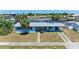 Beautiful single-story waterfront home with a well-maintained lawn and canal views at 149 Roselle Ct, Port Charlotte, FL 33952