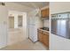 Compact kitchen featuring essential appliances and an open layout to adjacent living area at 149 Roselle Ct, Port Charlotte, FL 33952