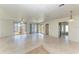 Bright living room featuring sliding glass doors and neutral toned flooring at 149 Roselle Ct, Port Charlotte, FL 33952