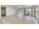 Bright living room featuring sliding glass doors and neutral toned flooring at 149 Roselle Ct, Port Charlotte, FL 33952