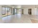 Bright living room featuring sliding glass doors and neutral toned flooring at 149 Roselle Ct, Port Charlotte, FL 33952