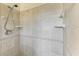 Tiled walk-in shower features a sleek design and convenient shower head at 149 Roselle Ct, Port Charlotte, FL 33952