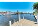 Waterfront property with boat dock and lush tropical foliage at 149 Roselle Ct, Port Charlotte, FL 33952