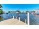 Waterfront property featuring a private dock with boats on the canal at 149 Roselle Ct, Port Charlotte, FL 33952