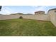 Large backyard with a well-maintained lawn and privacy fence at 15729 Fort Island Pl, Sun City Center, FL 33573