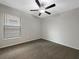 Bedroom featuring a ceiling fan, window with blinds, and neutral carpet at 15729 Fort Island Pl, Sun City Center, FL 33573