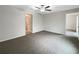 Spacious bedroom features neutral walls, plush carpet, and a modern ceiling fan at 15729 Fort Island Pl, Sun City Center, FL 33573