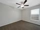 Bedroom featuring carpeted floors, a ceiling fan, and a window providing natural light at 15729 Fort Island Pl, Sun City Center, FL 33573