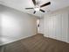 Bedroom featuring a ceiling fan, neutral carpet, and closet at 15729 Fort Island Pl, Sun City Center, FL 33573