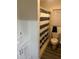 Modest bathroom with a white vanity, tiled shower with striped curtain, and toilet at 744 Myrtle Ave, Venice, FL 34285