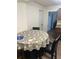 Cozy dining area features a round table with a decorative tablecloth and seating for casual meals at 744 Myrtle Ave, Venice, FL 34285