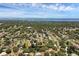 Gorgeous aerial view of the neighborhood with lush greenery extending to the waterfront city skyline at 1937 N Highland Ave, Clearwater, FL 33755