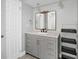 Modern bathroom with updated vanity, fixtures, and organized shelving unit at 1937 N Highland Ave, Clearwater, FL 33755