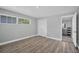 Bedroom featuring wood floors, a closet and access to the bathroom at 1937 N Highland Ave, Clearwater, FL 33755