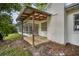 Exterior deck featuring a wood pergola extending off the side of the home at 1937 N Highland Ave, Clearwater, FL 33755