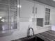 This stylish kitchen features custom cabinets, granite countertops, and subway tile backsplash at 1937 N Highland Ave, Clearwater, FL 33755