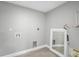 A laundry room features washer/dryer hookups, a mirror, and a water heater at 1937 N Highland Ave, Clearwater, FL 33755