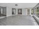 This expansive living room boasts tile floors and abundant natural light at 1937 N Highland Ave, Clearwater, FL 33755