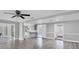 Open floor plan showcasing the kitchen and living spaces with modern flooring and neutral tones at 1937 N Highland Ave, Clearwater, FL 33755