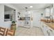 Bright kitchen with white cabinets, tile floor, and wood countertops, creating an efficient and stylish culinary space at 204 Ne Jefferson N Cir, St Petersburg, FL 33702