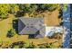 Overhead view of the home showcasing the roof, driveway, and landscaping at 4313 Appleton Ter, North Port, FL 34286