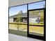 View of the home's backyard and patio area through sliding glass doors at 4313 Appleton Ter, North Port, FL 34286