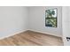 Bright, airy bedroom featuring a large window with a green outdoor view at 4313 Appleton Ter, North Port, FL 34286