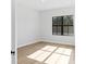A light filled bedroom with a large window and wood floors creates a bright and inviting atmosphere at 4313 Appleton Ter, North Port, FL 34286