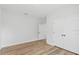 Neutral bedroom with light wood floors and white doors to hallway and closet at 4313 Appleton Ter, North Port, FL 34286