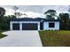 Charming single-story home featuring a two-car garage and a well-maintained lawn at 4313 Appleton Ter, North Port, FL 34286