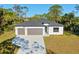 Exterior front view of a modern two-story home with a well-manicured lawn at 4313 Appleton Ter, North Port, FL 34286